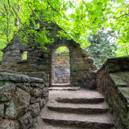 An abandoned stone building, called the Witch’s Castle, sits in the middle of Forest Park in Portland, links to information about Portland’s haunted past.
